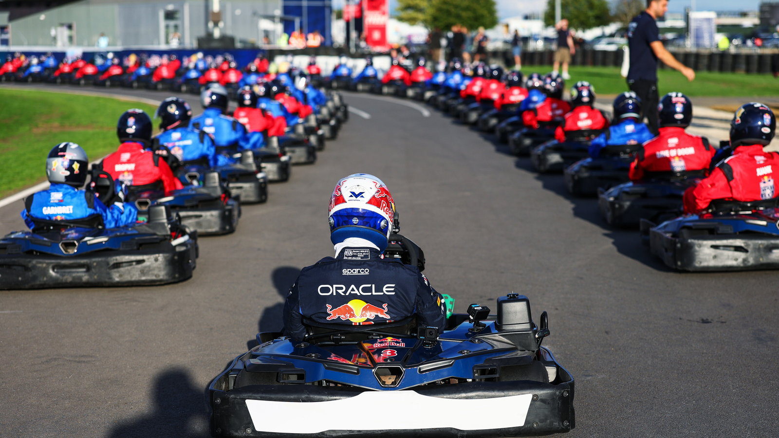 The grid at Silverstone, Max Verstappen's kart leading one hundred others