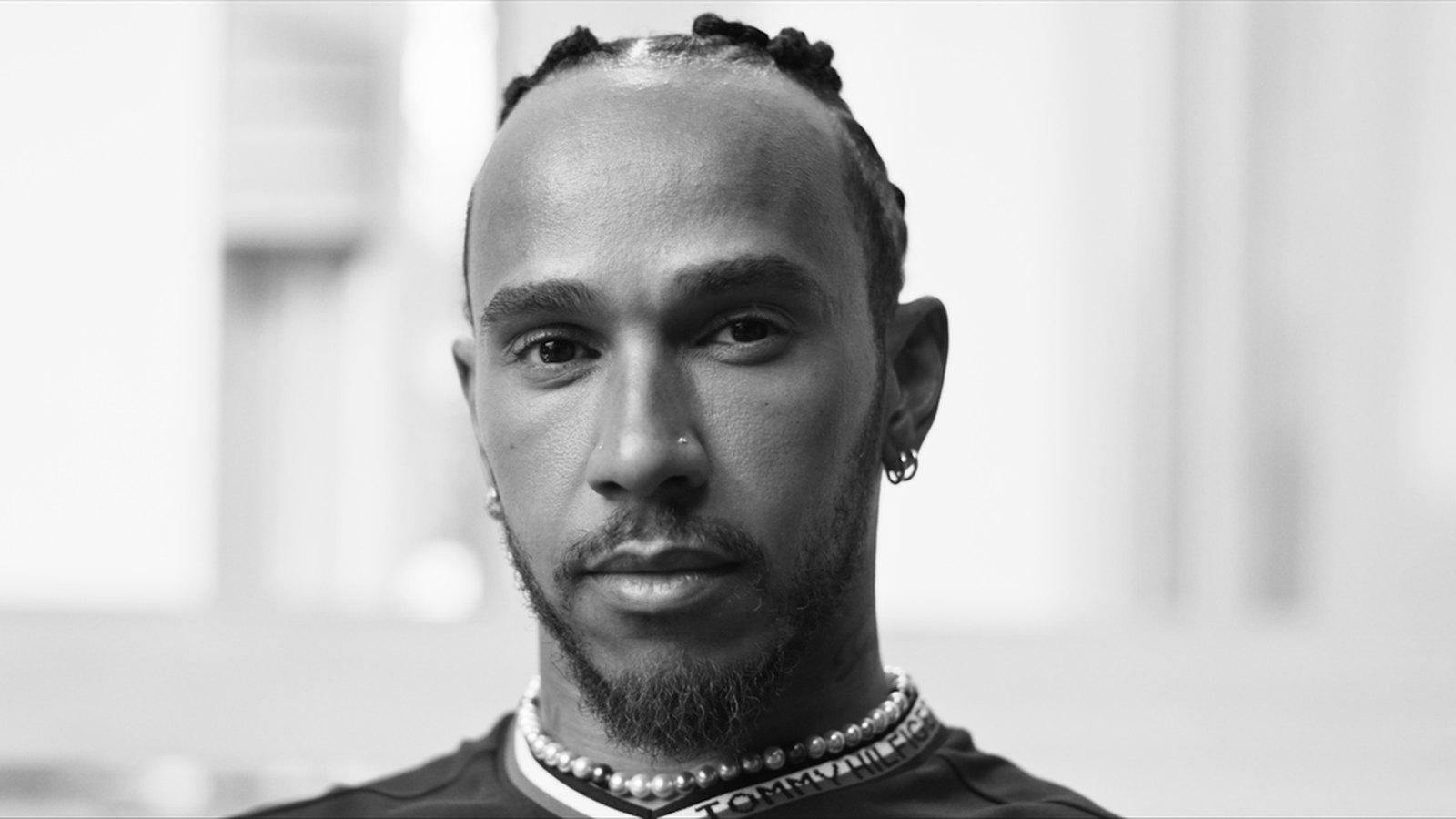 Lewis Hamilton in black and white, looking to camera